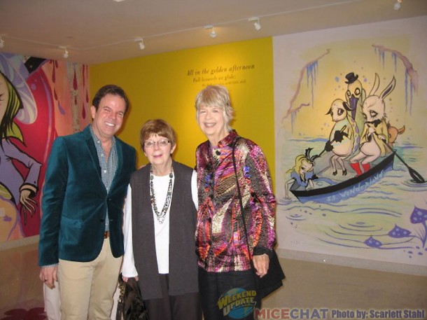Kevin and Jeanne Chamberlain, and Maggie Richardson with the ARt of CAmille Rose Garcia covering the wall.
