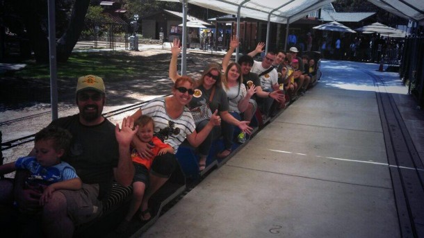 A group of The Optimists ride the trains near Walt's Barn