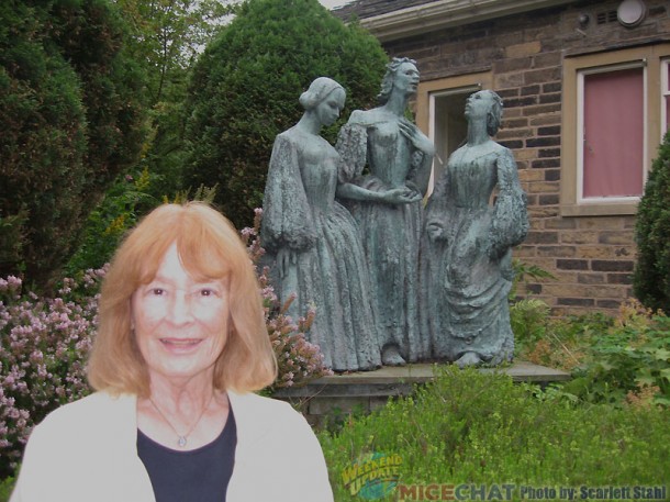 Scarlett in the garden with the statue of the three Bronte sisters