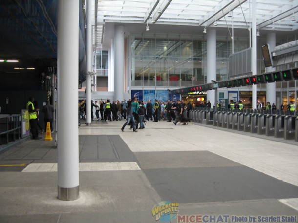 Group going to a soccer game in train station