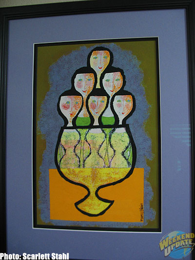 The Goblet People --- appropriately hangs over the bar and wine rack.