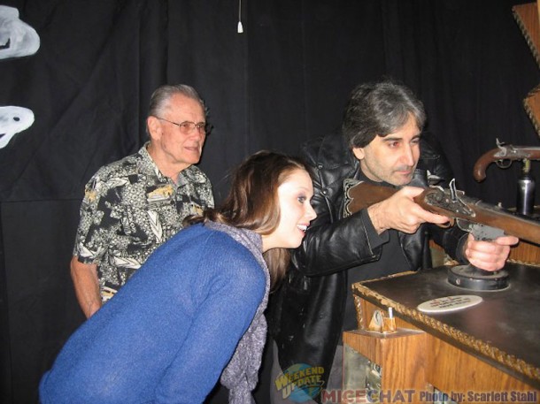 Mark Silverman playing the arcade game, being observed by Jessica Haganey and Bill Hogarth, formerly of Disneyland Arcades)