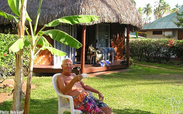 Bob enjoying high tea at his thatched hut