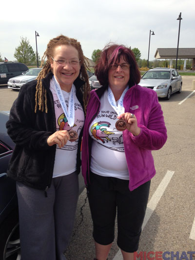 Terri and Anita with their “Flying Pig Race Finisher Medals.”