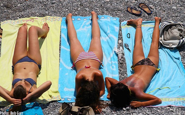 Italian girls can endure the hot gravel and sun to get a bronze look.