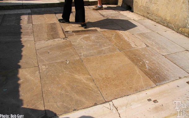  A large bath house entry is paved in polished marble.