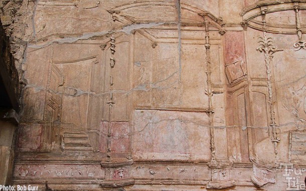 The bath house walls are decorated in intricate carved marble relief.