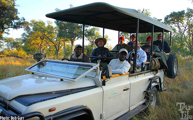 Two rangers explain every detail of the wildlife to safari guests