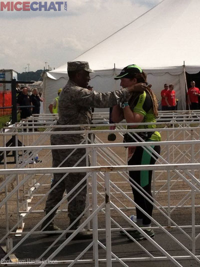 Terri gets her medal from a fit airman.