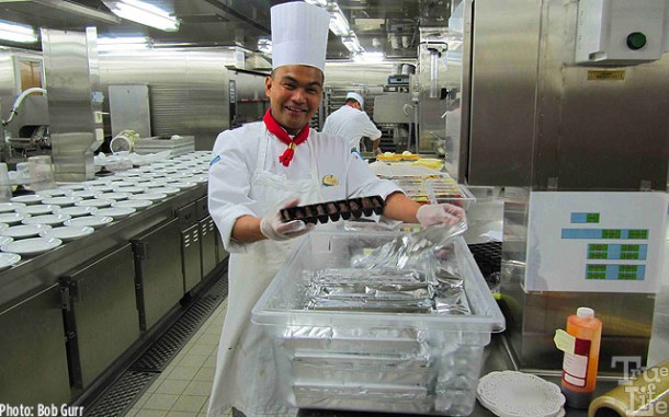 A kitchen pastry chef prepares the day's goodies.