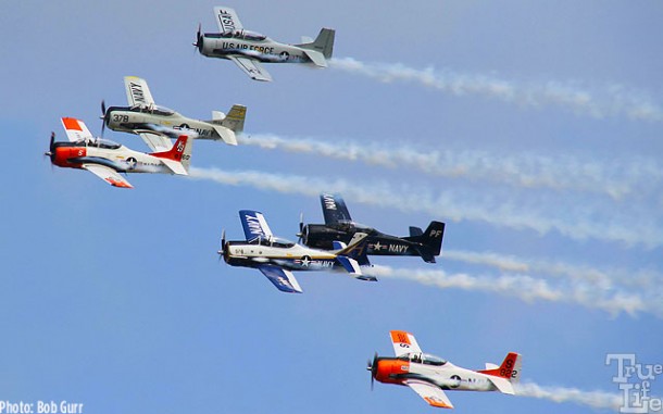 A squadron of Grumman T-28 Trojans display various service colors