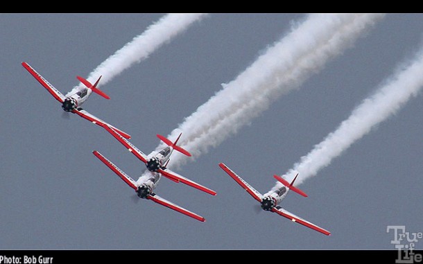 Aeroshell aerobatic team of WWII North American T-6 smoking'