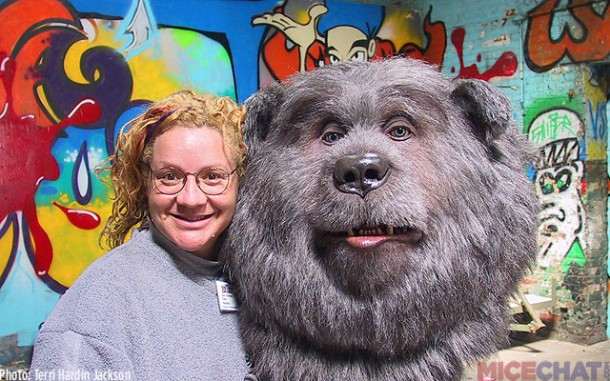 Terri poses between programming Big Al head.