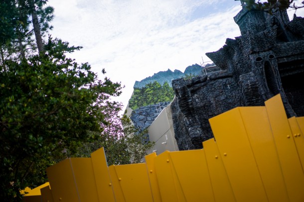 Foliage is being painted on the exterior of the building facade.