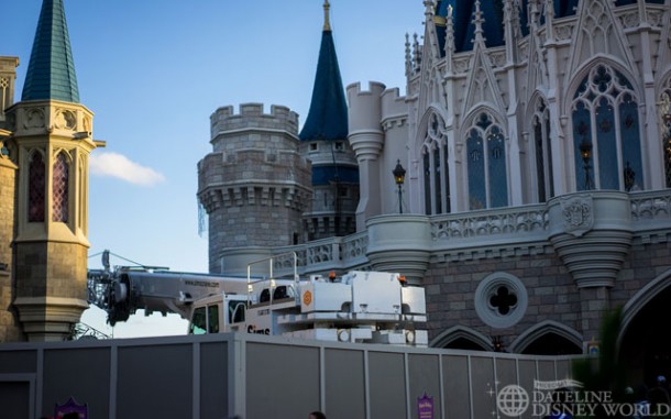 There is a crane on site for removal of the holiday lights from Cinderella Castle.