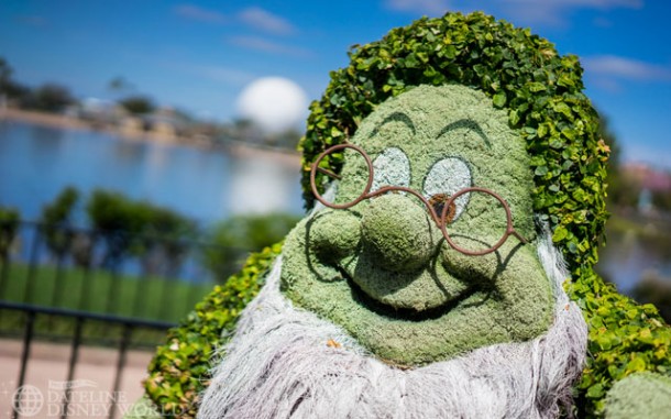 Snow White and the Seven Dwarfs topiaries are installed.