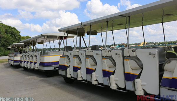 Trams pick up and drop off driving guests in the parking lot every few minutes.