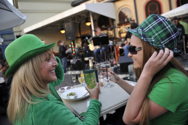 Downtown Disney guests Denise Van Beck (left) and her daughter Jenna Van Beck (right), 17, of Osprey, Fla., tip their hats to the band at Raglan Road Irish Pub & Restaurant in Downtown Disney in Lake Buena Vista, Fla. The 'Mighty St. Patrick's Festival' runs March 13-17 and features Irish bands and pro dancers, beers on tap, specially crafted food, face painting and plenty of St. Patrick's Day memorabilia. (Gene Duncan, photographer)