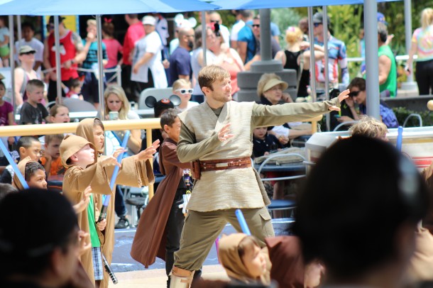 Masters and Students join in using the Force to raise the Jedi Temple.