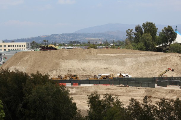Dirt in transition stands four stories tall.