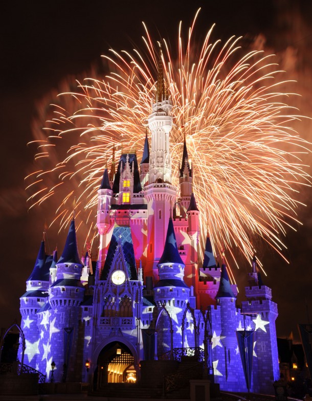 Fireworks light up the sky and illuminated image projections create a patriotic exterior on Cinderella Castle at the Magic Kingdom in Lake Buena Vista, Fla.  Spectacular fireworks displays with brilliant bursts of light coloring the night sky above the theme parks have been a Walt Disney World Resort entertainment specialty for decades. The July 4th fireworks typically are one of the most elaborate nighttime spectacles ever seen at a Disney theme park.  (David Roark, photographer)