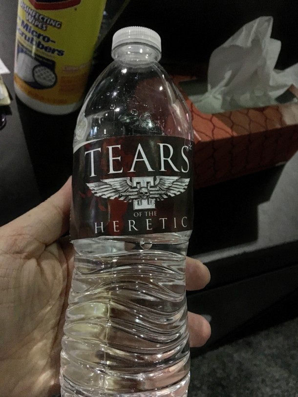 A water bottle from the most beautiful game on the floor, tucked away in a corner.