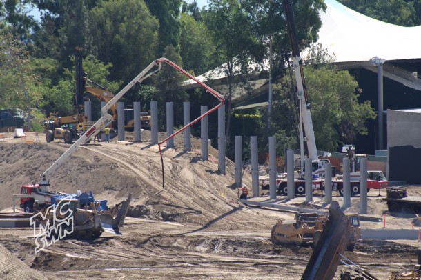 A crane picks up an I beam.