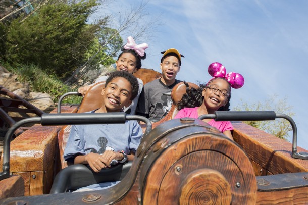 (Clockwise from top left) Actors Yara Shahidi, Marcus Scribner, Marsai Martin and Miles Brown, from the cast of the ABC series "black-ish," ride Seven Dwarfs Mine Train (Mariah Wild, photographer)