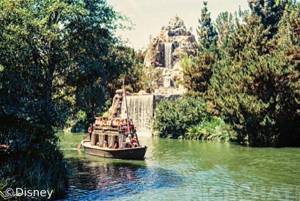 A Mike Fink Keel Boat cruises the Rivers Of America past Cascade Peak