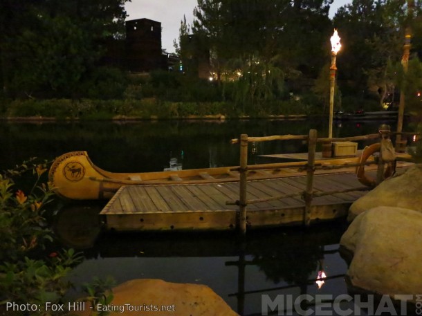 Sleeping canoes rest for night, dreaming of happy park guests paddling into the wolderness on the Rivers Of America.