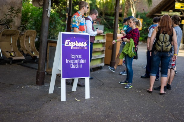 Express transportation loads right near the Safaris entrance, and the loud purple sign doesn't fit in at all.