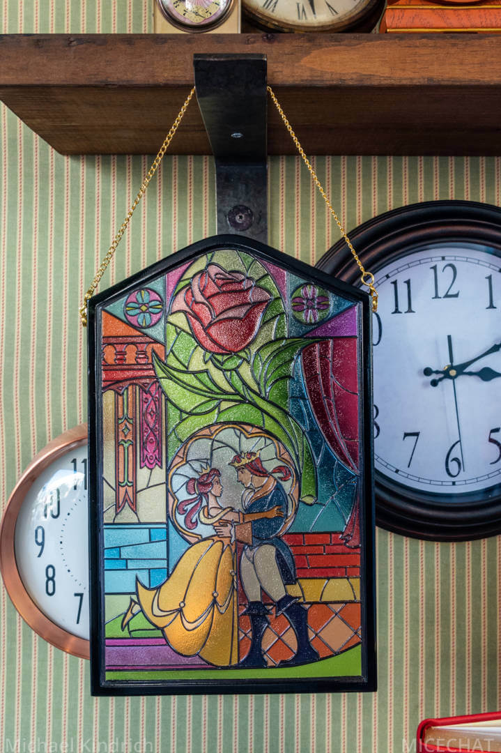 A stained glass sun-catcher with art from Beauty and the Beast, sold at Disney Home