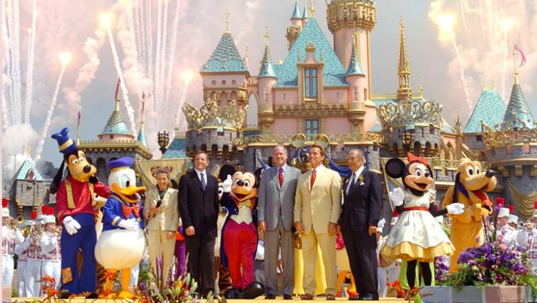 Michael Eisner and Bob Iger on stage with guests