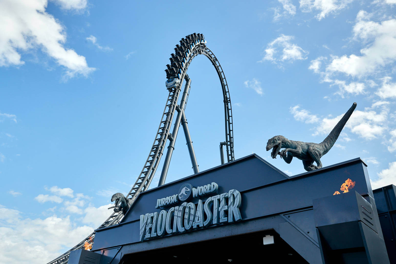 Coaster cars crest the lift hill of Velocicoaster