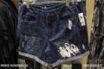 downtown-disney-world-of-disney-haunted-mansion-hitchhiking-ghosts-wallpaper-denim-womens-shorts
