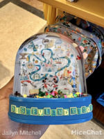 disney-california-adventure-elias-and-co-play-in-the-park-snow-globe