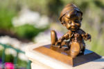 Disneyland hub Pinocchio statue spring flowers DSC_0485-X5