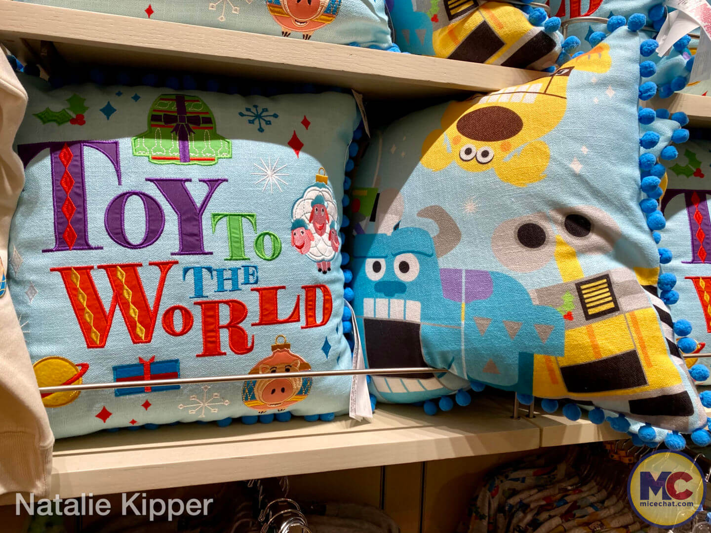 https://www.micechat.com/wp-content/uploads/2022/10/Disneyland-disney-parks-christmas-holiday-merchandise-2022-pixar-toy-to-the-world-decorative-pillow.jpg