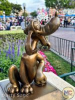Disneyland News beauty pluto hub statue MiceChat