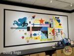 Pixar Place Hotel art behind register