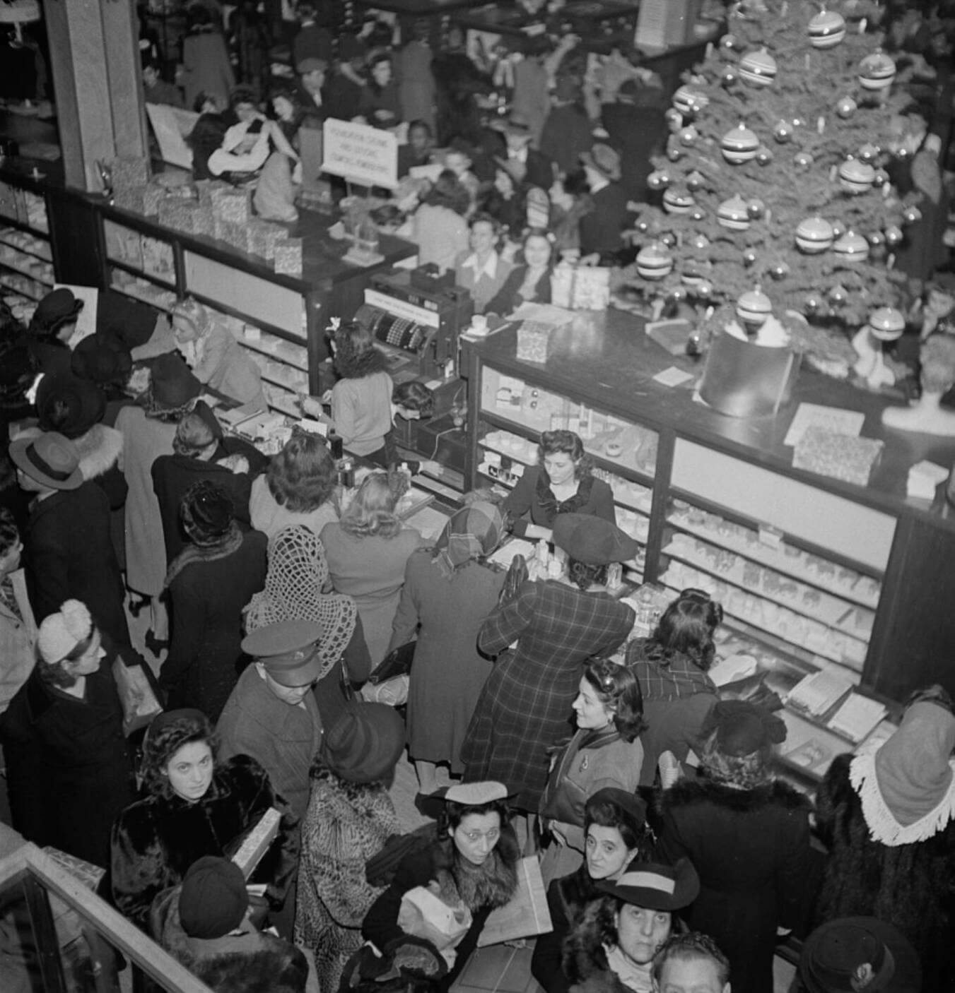 history of Christmas: Ladies shopping at Macy's in 1942