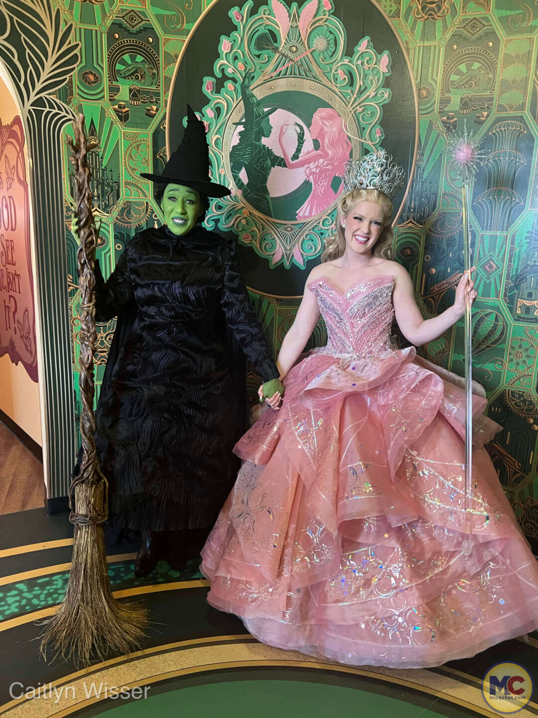 Elphaba and Glinda smiling at their meet and greet at the Wicked store at Universal Orlando Resort