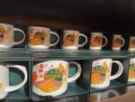 USH – Wicked Starbucks mug – Munchkinland