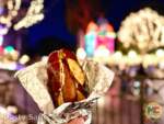 disneyland holiday food Bratwurst in a cheesy garlic pretzel bread MiceChat