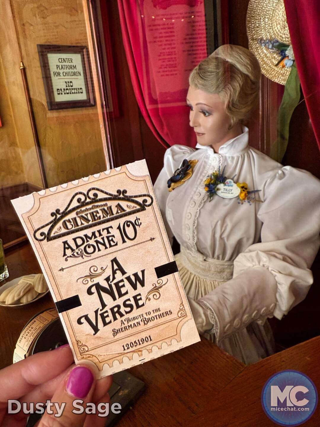 Tilly the ticket taker and MagicBand souvenir card at Main Street Cinema