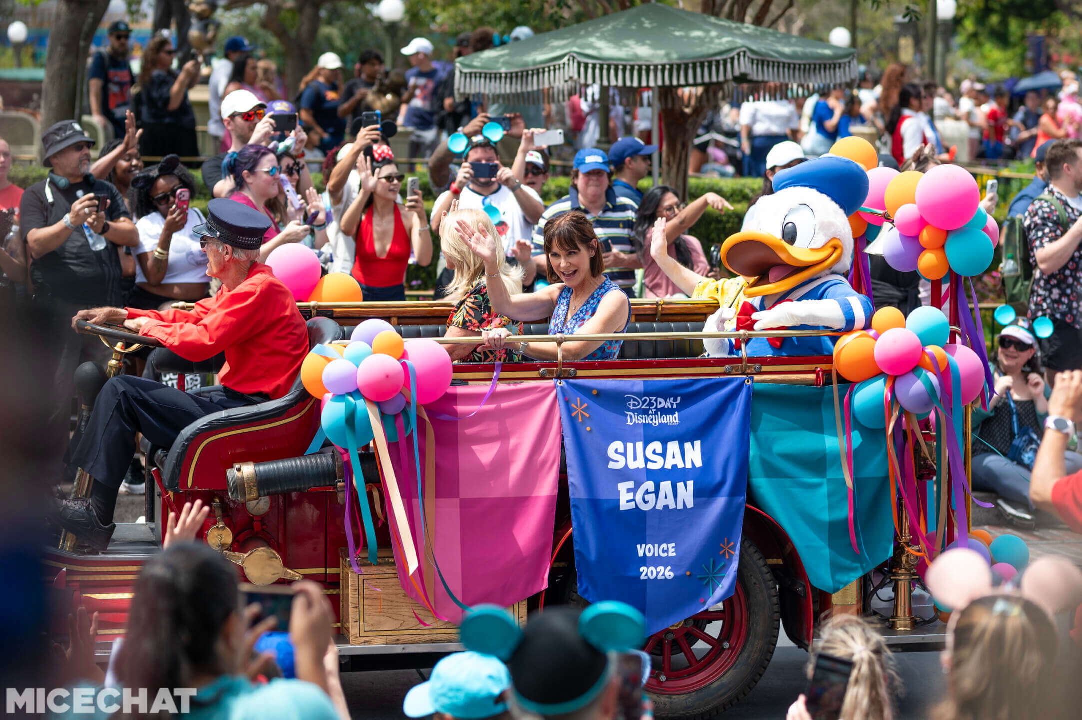 Disney Legends cavalcade vehicle passes Sleeping Beauty Castle at Disneyland