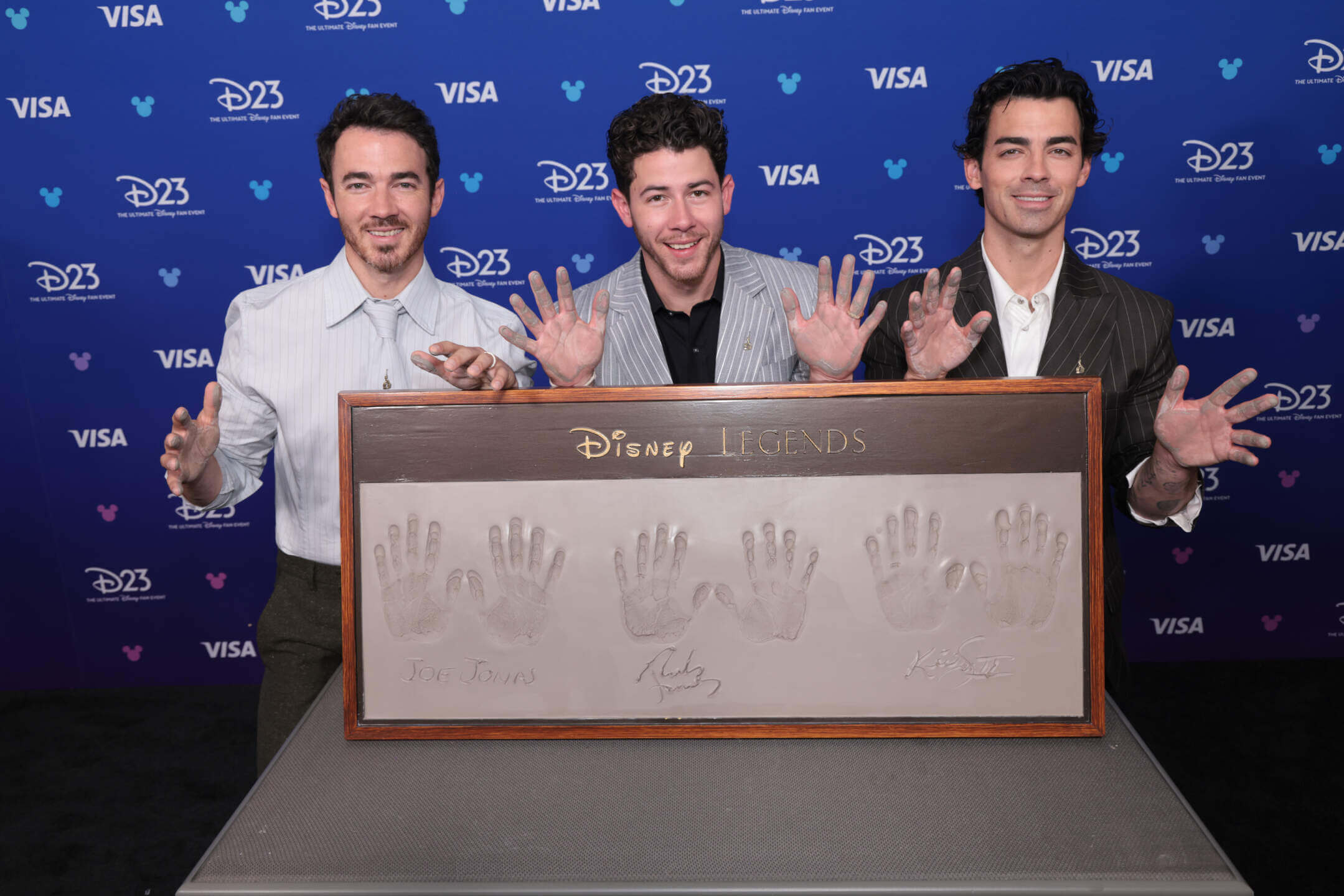 Kevin, Nick, and Joe Jonas accept their Disney Legends award at D23 2026