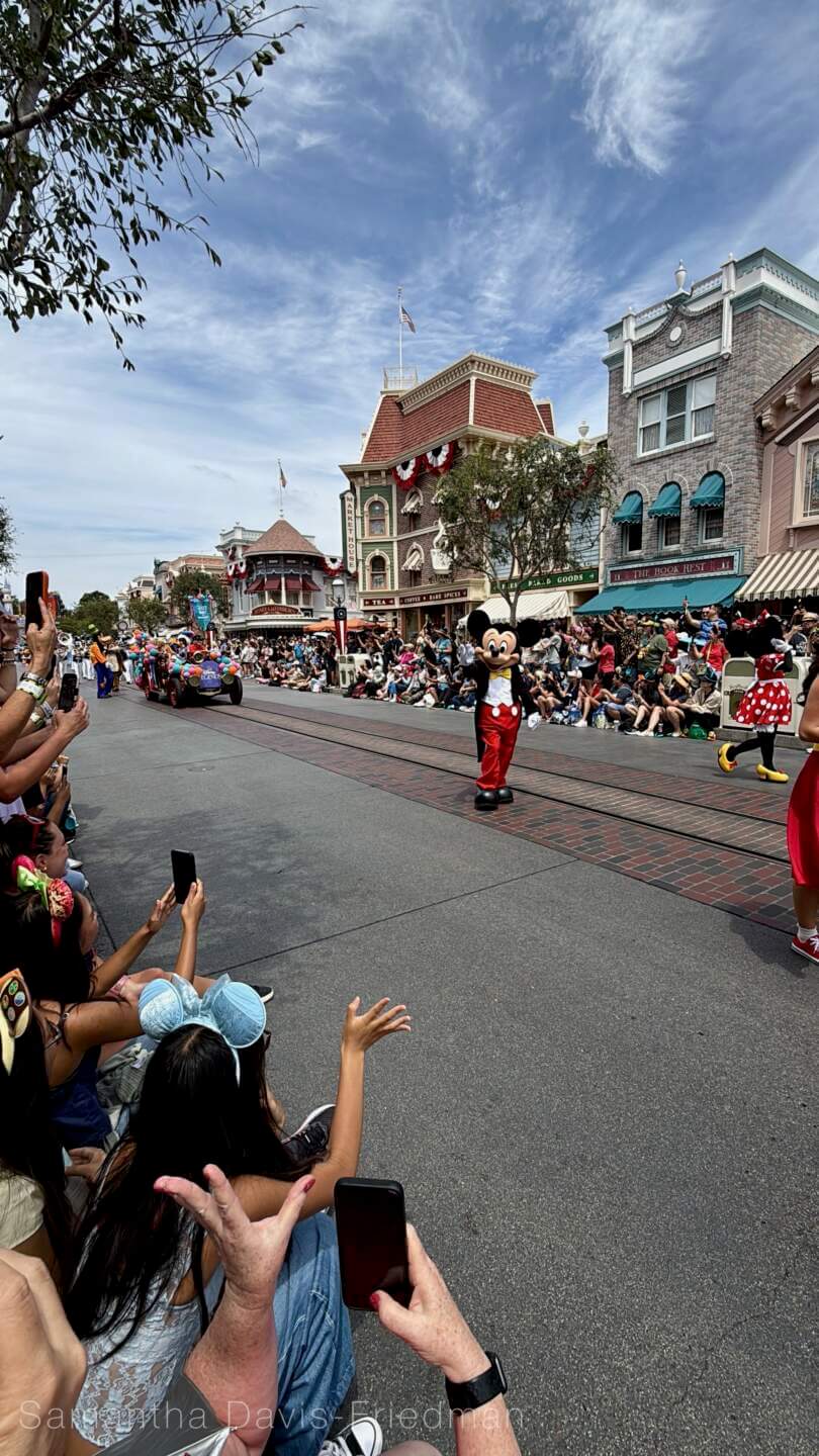 Disney Legends wave to guests during the D23 Day cavalcade at Disneyland