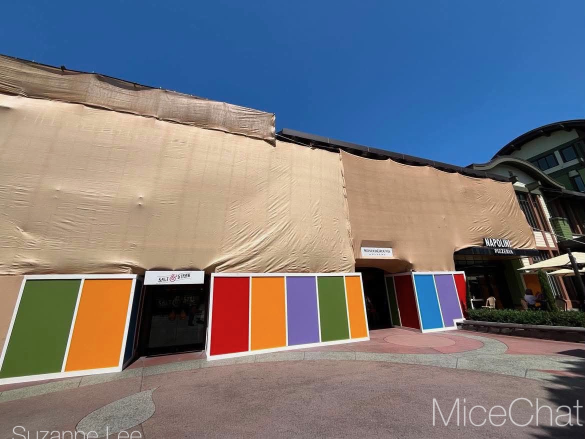 Construction scrims covering the Naples building at Downtown Disney, home to Salt and Straw, Wonderground, and Napolini