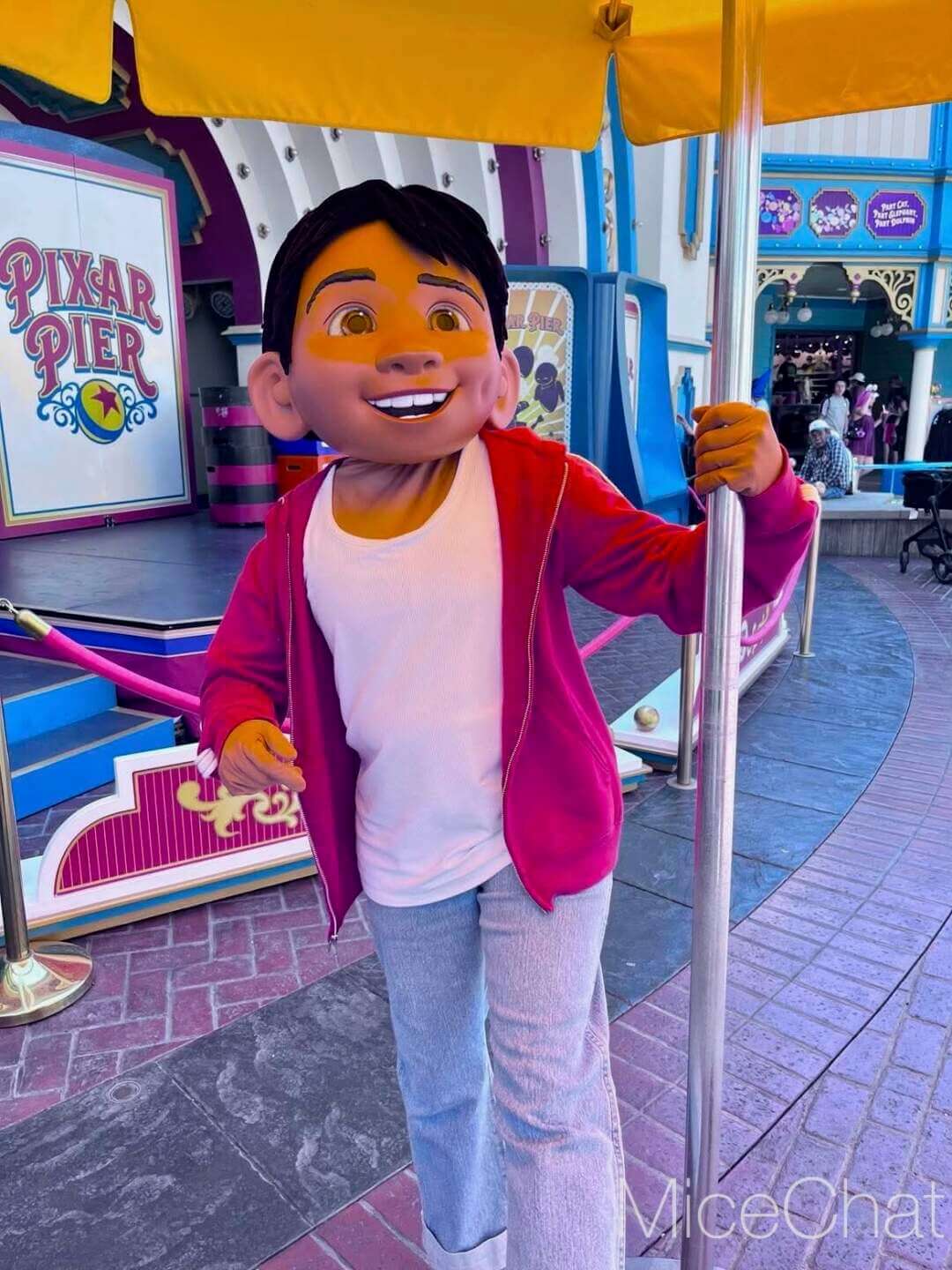 Miguel from Coco greeting guests during Plaza de la Familia at Disney California Adventure